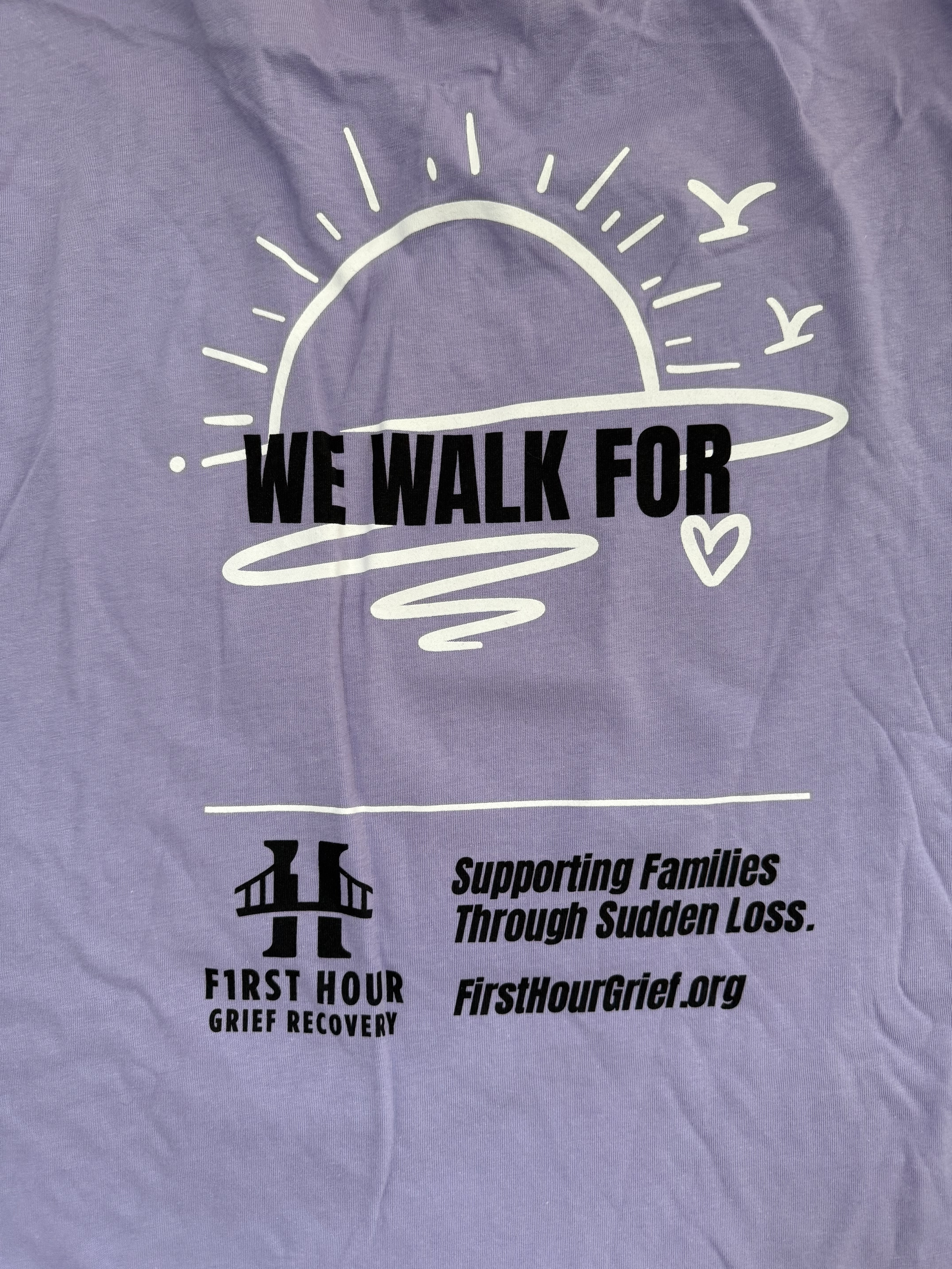 Shirt back with WE WALK FOR and a blank for a remembrance name